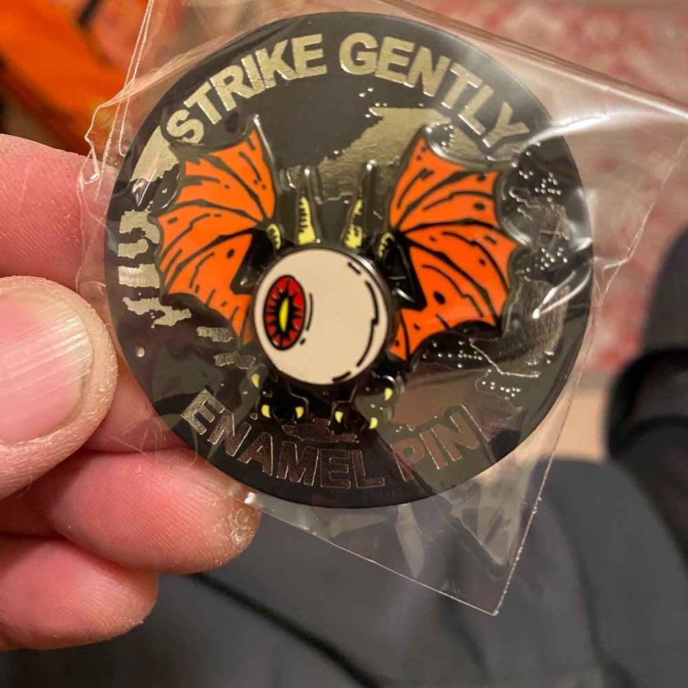 Brand New In Package Strike Gently Deluxe Spinning Flying Eyeball Enamel Pin